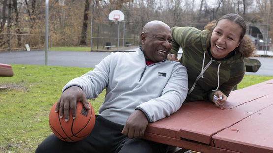 AHN cardiac patient spending time with his daughter at the basketball court